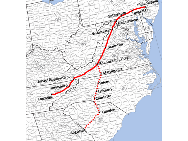 Black and White U.S. Map with a red line going up through the states.