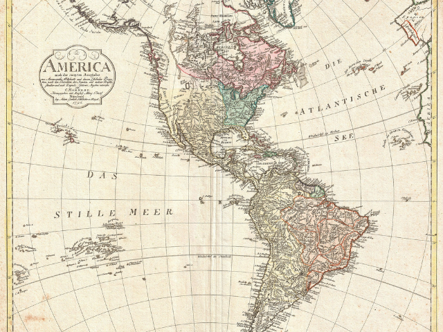 A yellowed map of North and South America