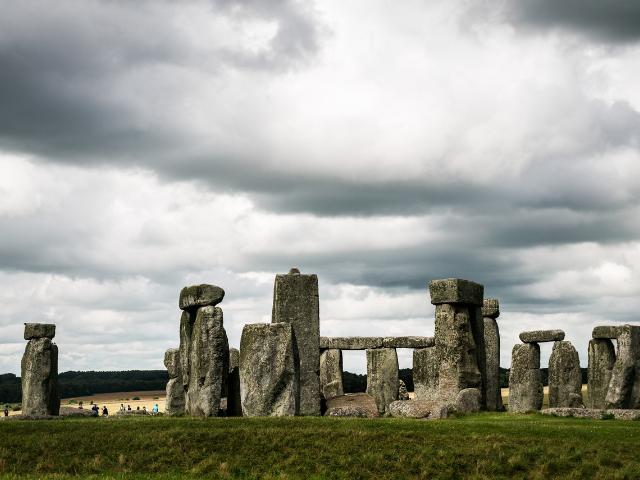 large stone structures under a cloudy sky,