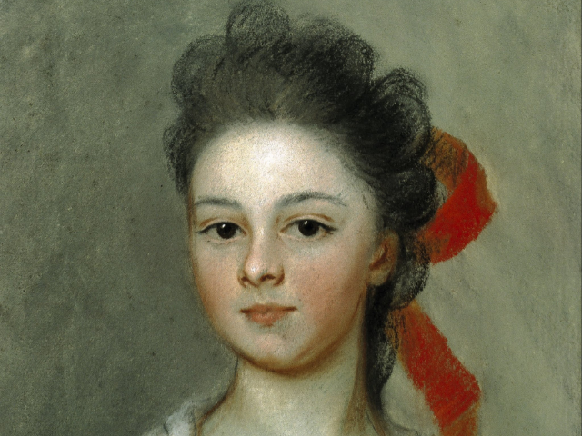A young woman with a red ribbon.