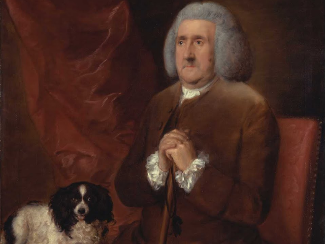 William Jones Lowndes with brown and white cocker spaniel.