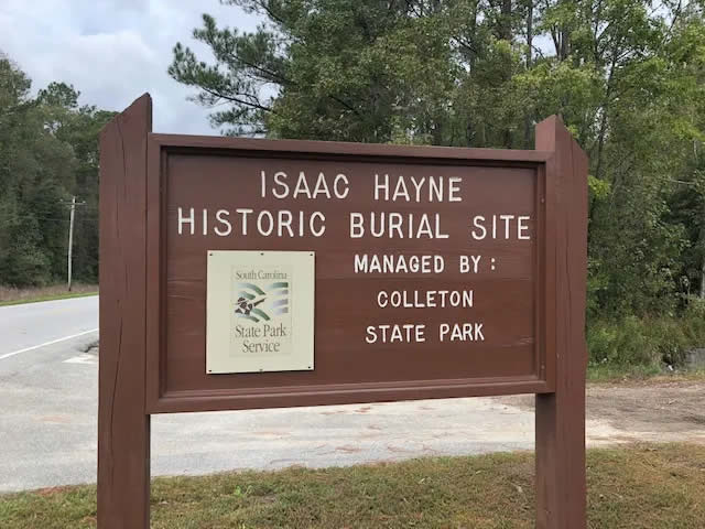 Sign for the The Historic Burial Site of Colonel Isaac Hayne.