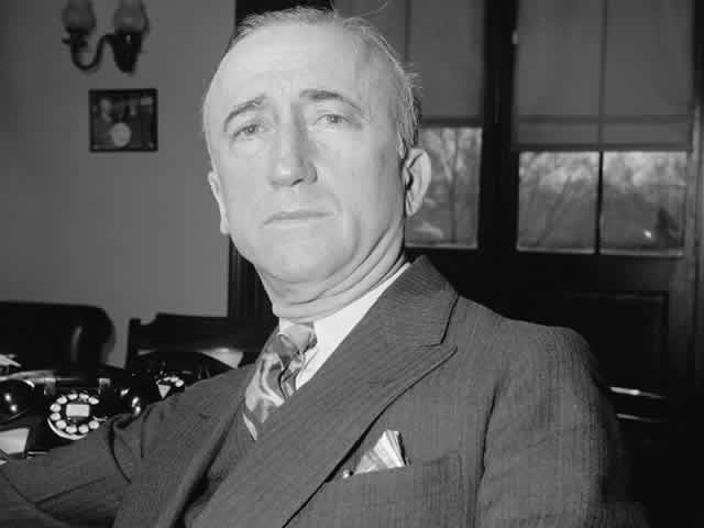 James F. Byrnes wearing a dark suit and patterned tie. 