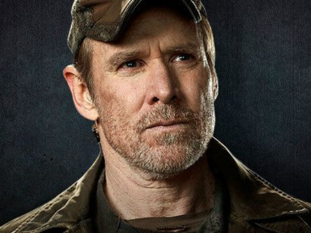 color photograph of Will Patton wearing a ball cap